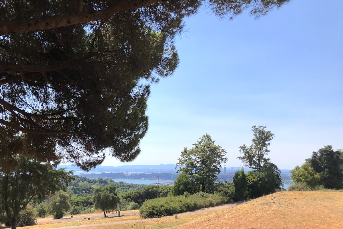 View point in Lisbon Monsanto Park overlooking the Tagus river and south bank